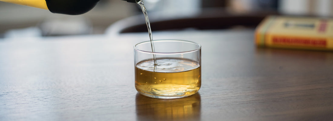 pouring tea into cup