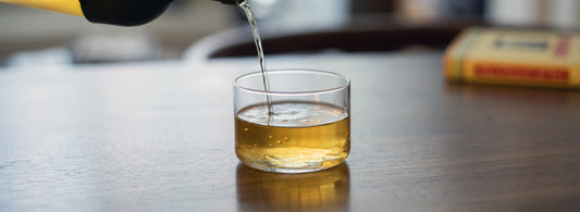 pouring tea into cup