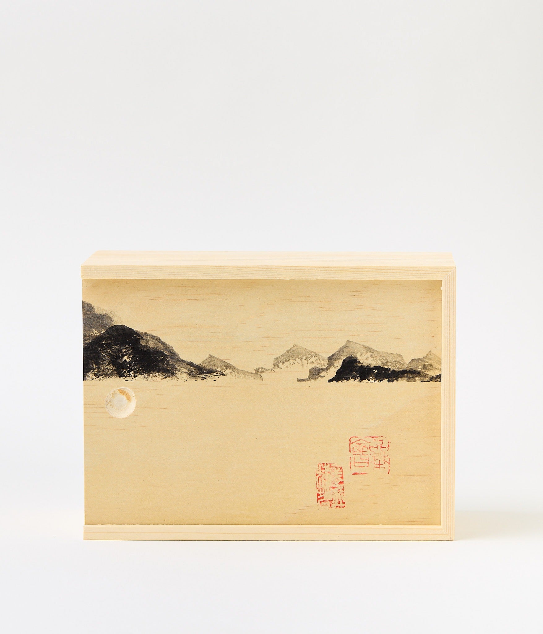 Wooden box with mountains and chinese stamps