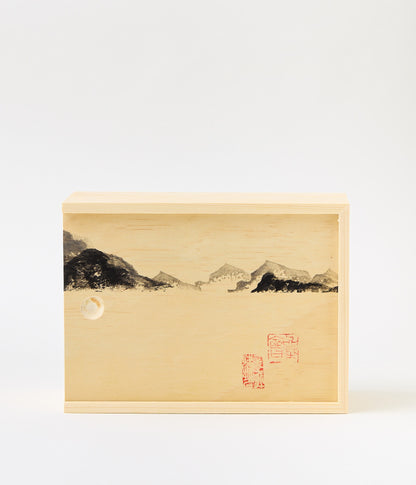Wooden box with mountains and chinese stamps