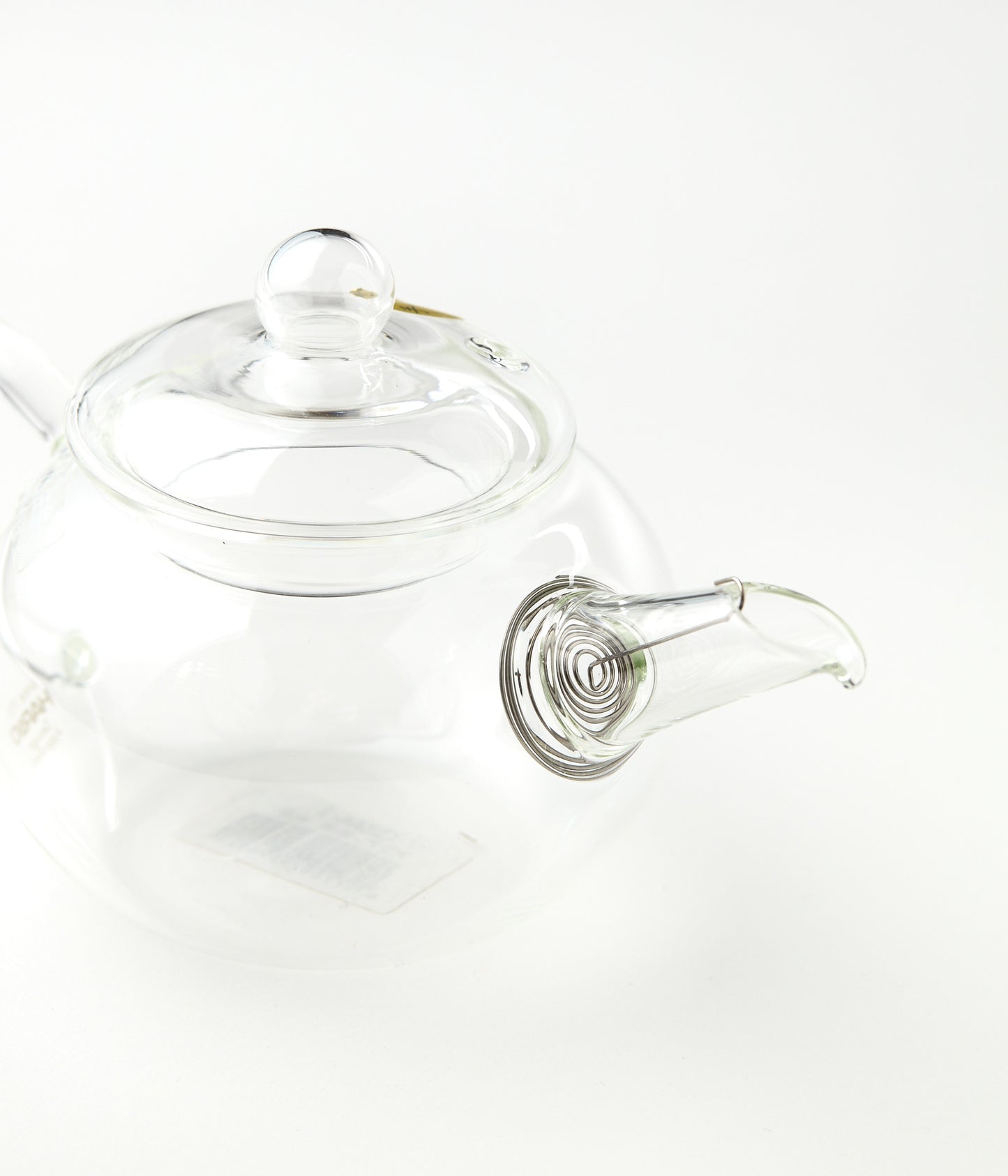 Clear glass teapot on a white background