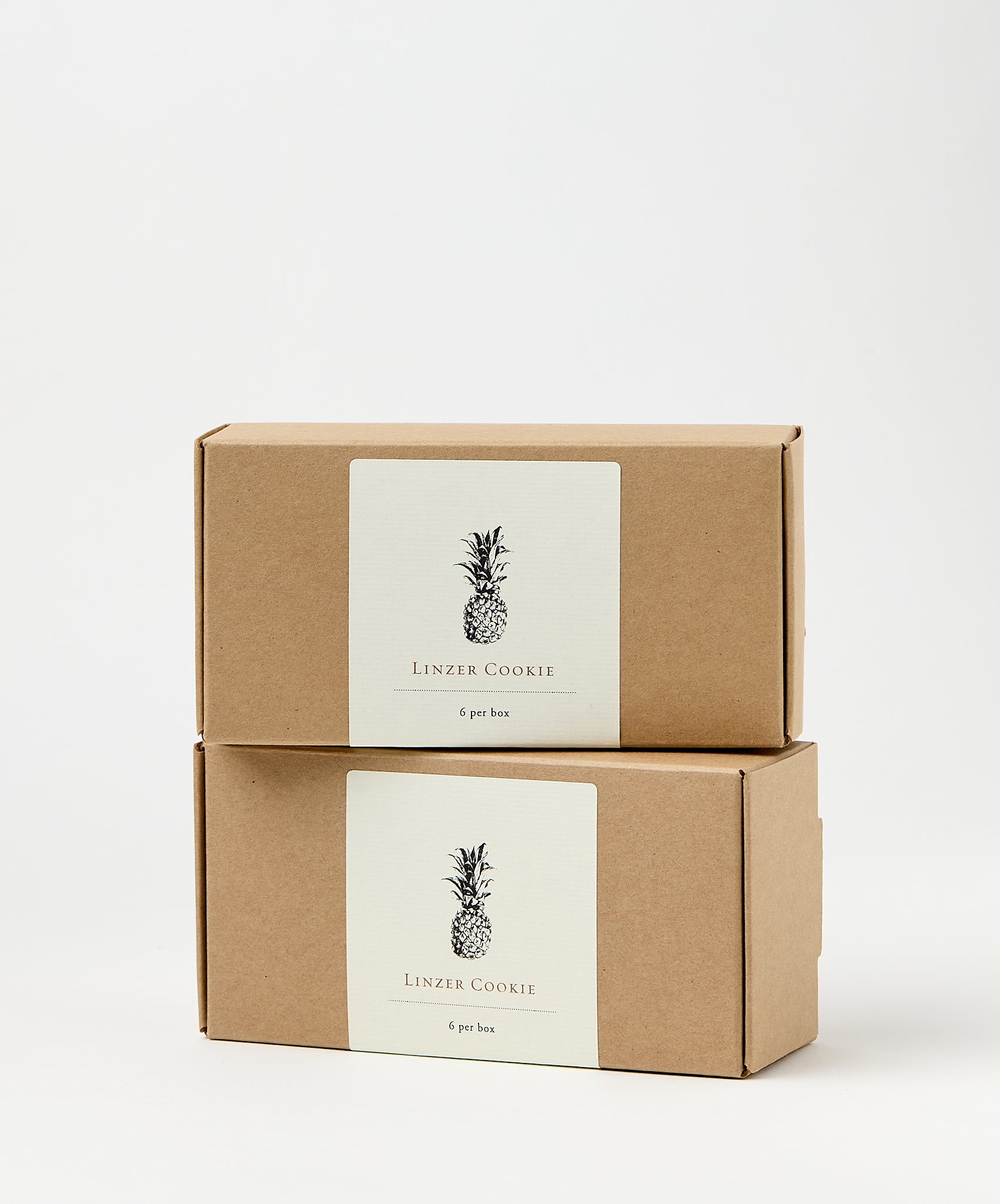 linzer cookie box with pineapple illustration
