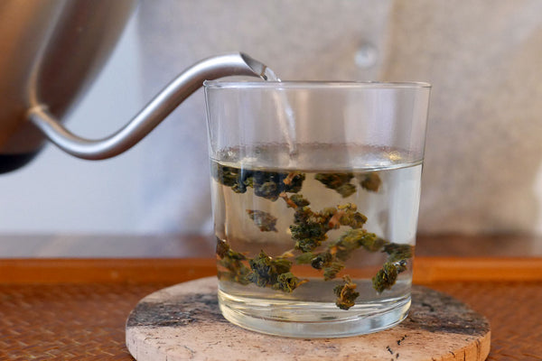 Pouring hot water for a steeping of tea.