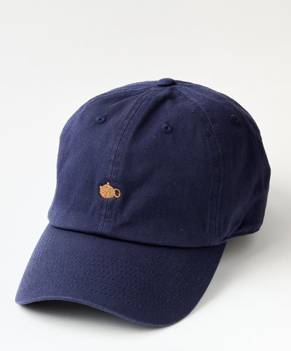 Navy blue baseball cap with a small embroidered golden teapot design on the front.