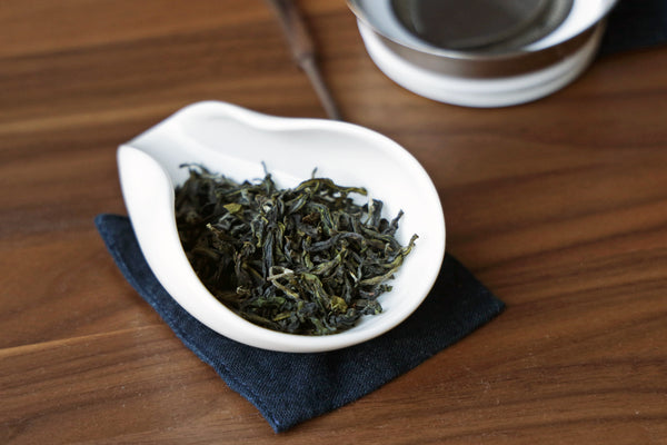 Loose tea leaves in a dish.